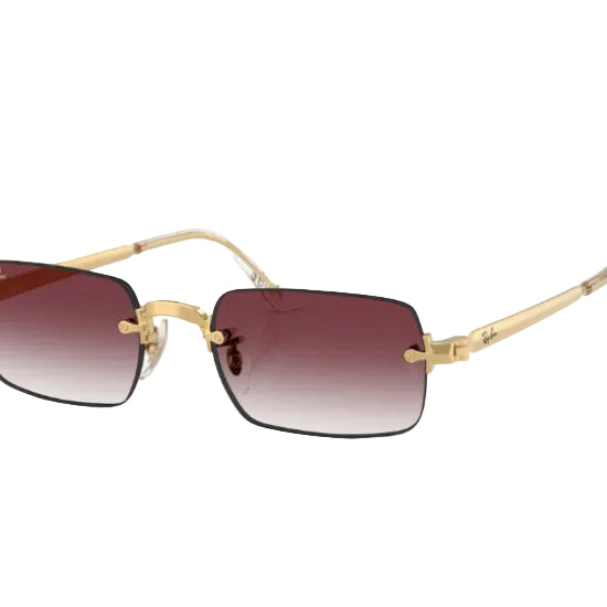 Gold-framed sunglasses with brown gradient lenses on a white background