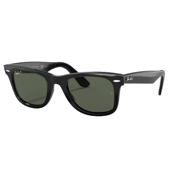 Tortoiseshell sunglasses with dark lenses on a white background