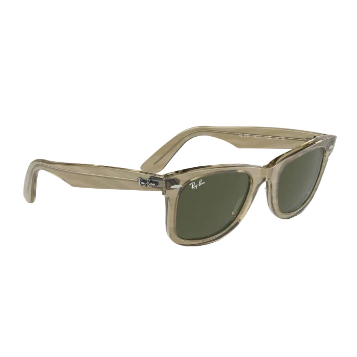 Beige sunglasses with green lenses on a white background