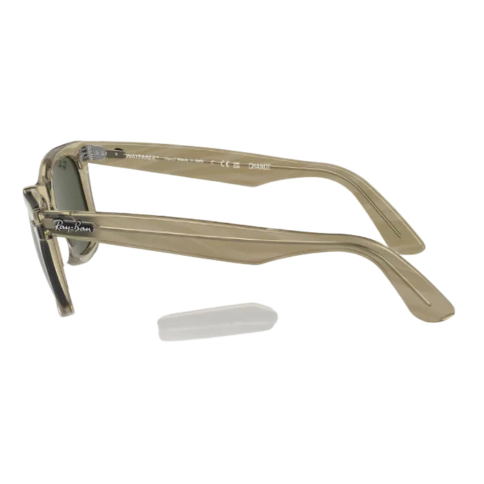 Sunglasses with a beige frame on a white background