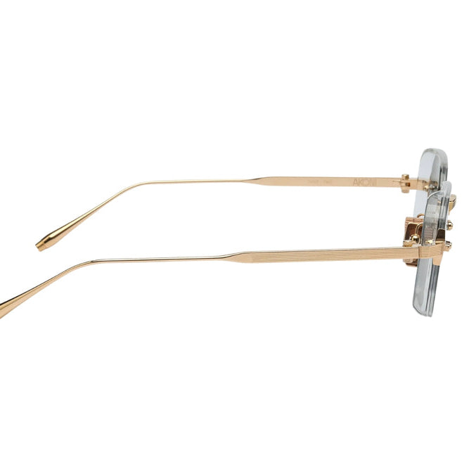 Gold-rimmed eyeglasses on a white background