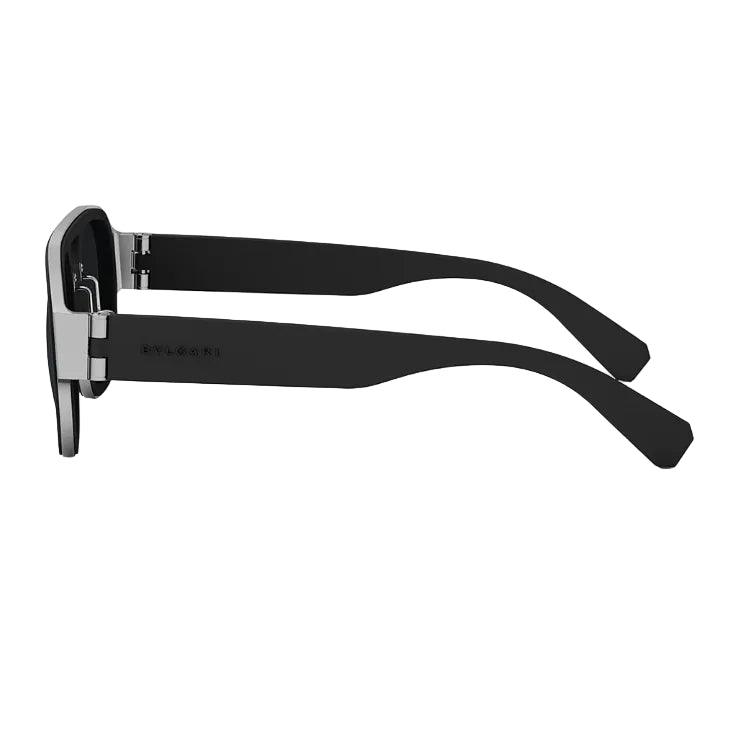 A pair of sunglasses shown from a side profile view, featuring matte black arms and a silver-toned metal frame with a black front, on a solid white background.