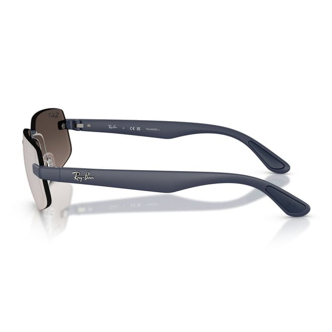 Ray-Ban sunglasses with a matte navy blue frame and dark brown tinted lenses, shown from a side profile on a white background with a soft reflection.