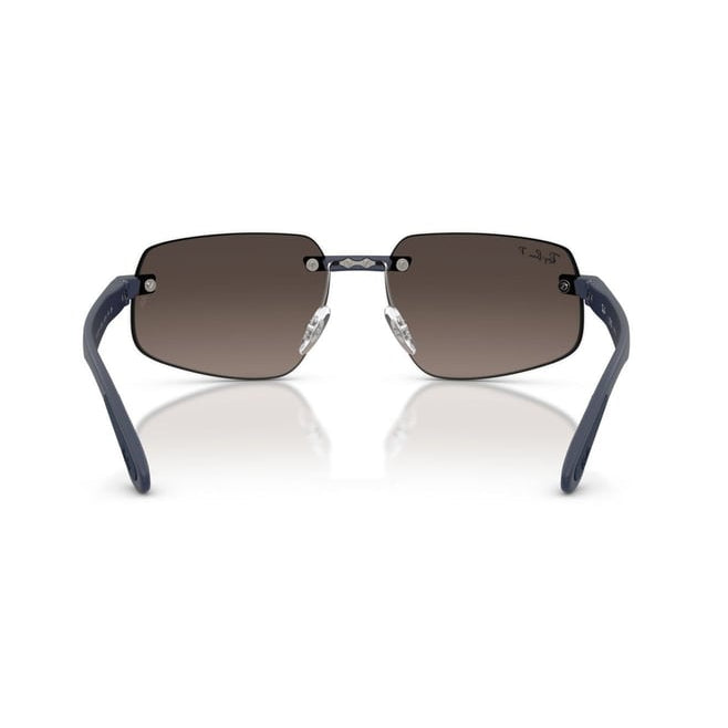 Rimless square sunglasses with dark brown gradient lenses and navy blue temples, shown from the front on a white background with a soft reflection.
