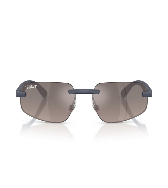 Ray-Ban rimless sunglasses with dark gray lenses and a navy blue metal frame, shown on a clean white background with a subtle reflection.