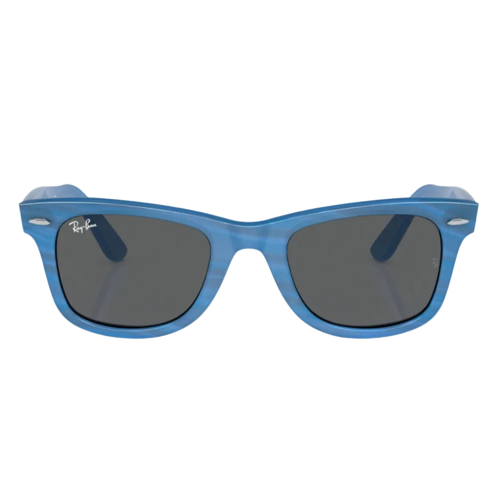 Blue sunglasses with dark lenses on a white background