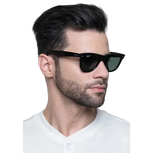 A man with styled dark hair and a short beard wearing black Ray-Ban sunglasses with dark lenses, shown in a close-up profile against a light gray background.