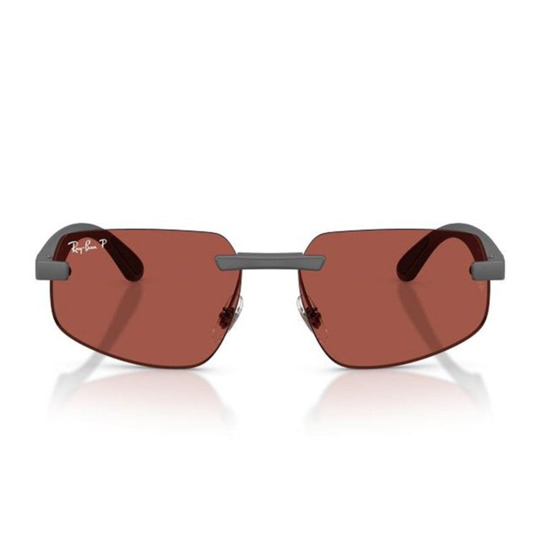 Ray-Ban rimless sunglasses with reddish-brown lenses and a dark gray metal frame, shown on a white background with a soft reflection.